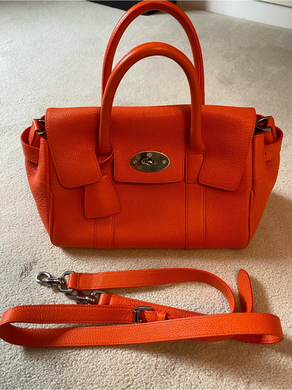 Structured Orange Leather Satchel with Top Handles and Detachable Strap